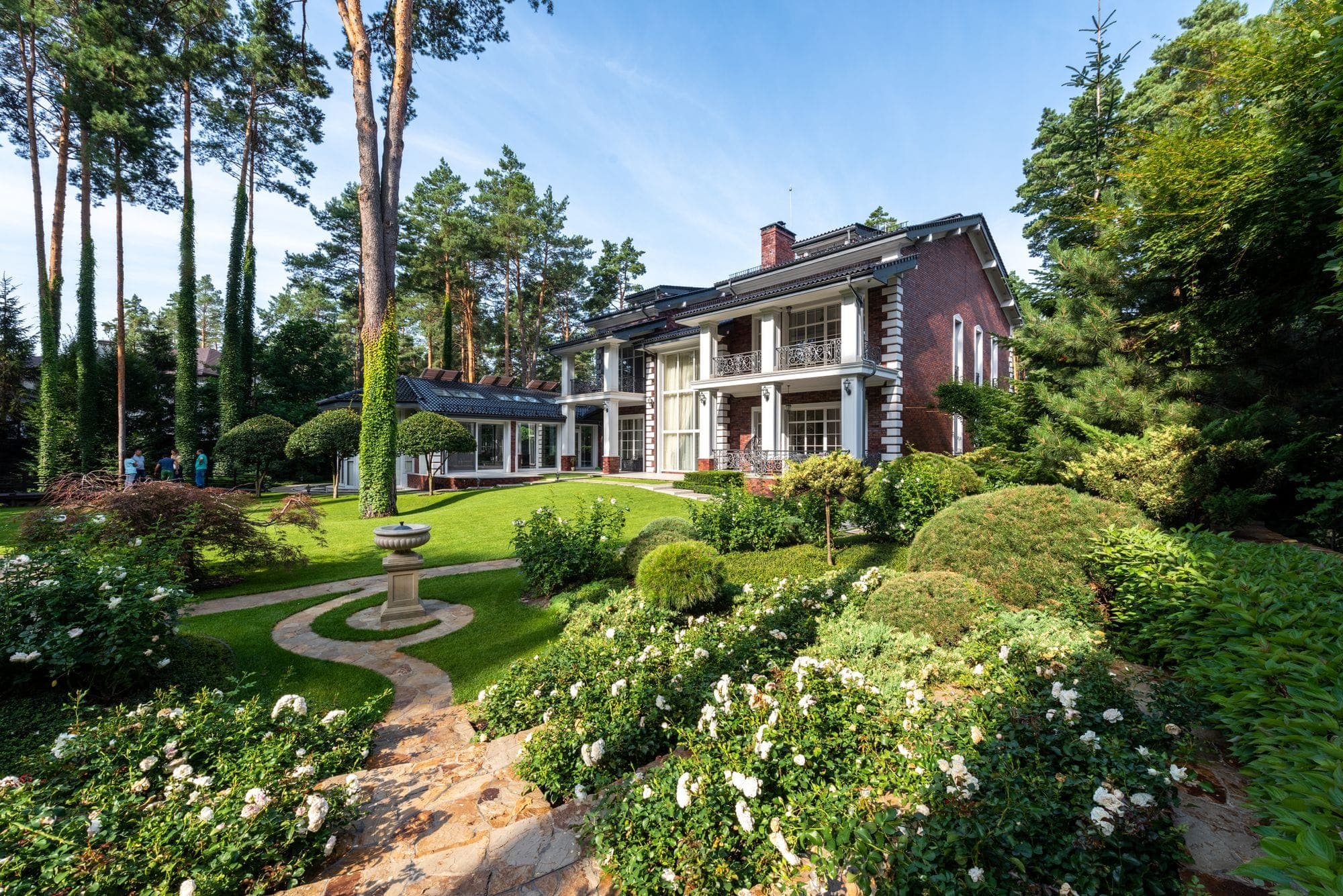 Landscaped garden with a stone path and planted beds