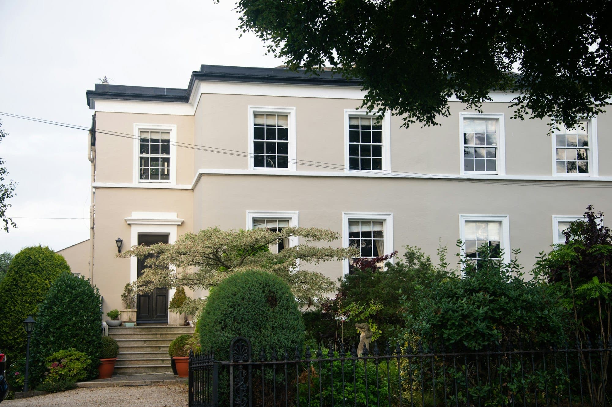Home exterior with rows of large sash windows